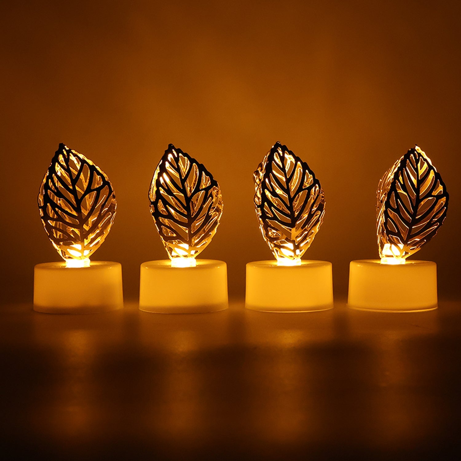 Decorative Golden Leaf Shaped Flameless LED Candles (4 Pc) Decorative Golden Leaf Shaped Flameless LED Candles (4 Pc)